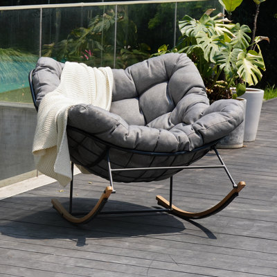 Chaise berçante en acier avec coussin
