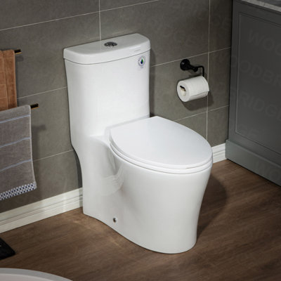 WoodBridge Solace 1.28 GPF Elongated 1.5 Comfort Height Chair Height Floor Mounted One-Piece Toilet with Seat Included