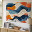 La toile crée un motif abstrait avec des formes tourbillonnantes fluides dans un art mural Mélange harmonieux de couleurs, y compris de riches oranges sur toile-125504843