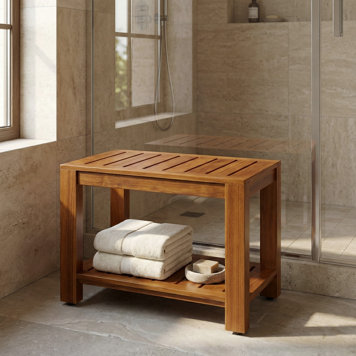 A teak shower bench with towels and soap.