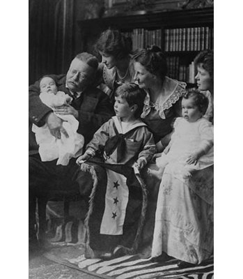 " Teddy Roosevelt Holds A Baby In His Arms In A Family Portrait "