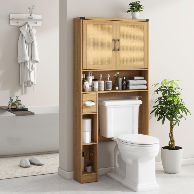 Armoire de rangement en rotin au-dessus de la toilette