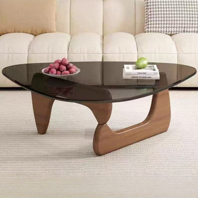 Table basse irrégulière avec plateau en verre noir et base en bois massif