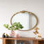 Miroir mural 30 po x 31 po avec finition dorée et écusson décoratif