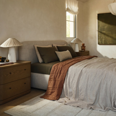 Bedroom with bed, nightstands, and lamps.