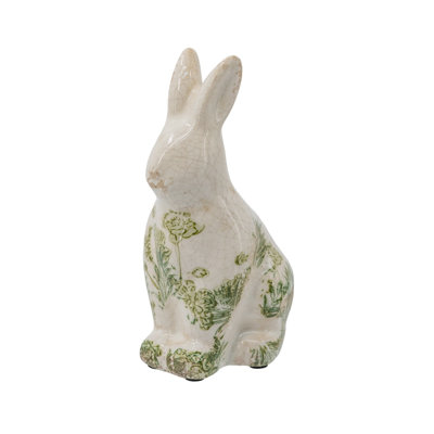 Figurine de lapin blanc en céramique avec motif floral vert