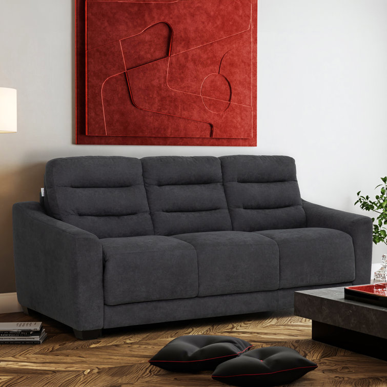 Modern style sofa with contrasting tufted back cushions