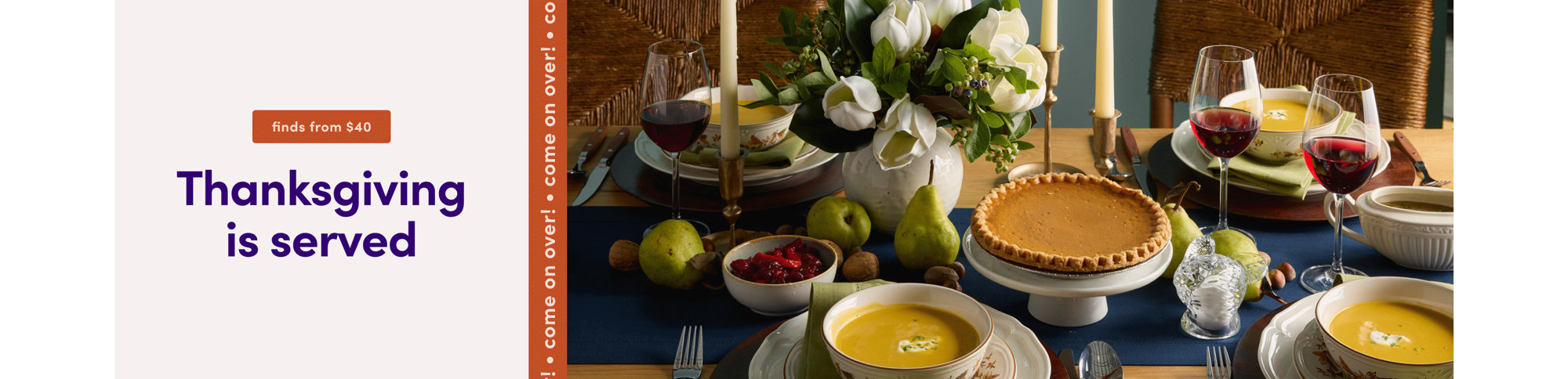 Thanksgiving is served, come on over! An elegantly set dining table features a centerpiece of white flowers, taper candles, bowls of soup, and a pumpkin pie.
