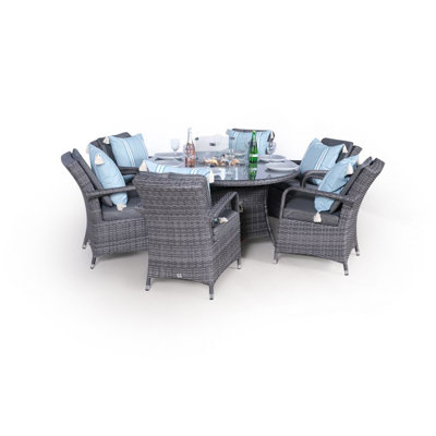 Ouellette 6 - Person Wicker Patio Dining Set with Round Table , Cushions Included
