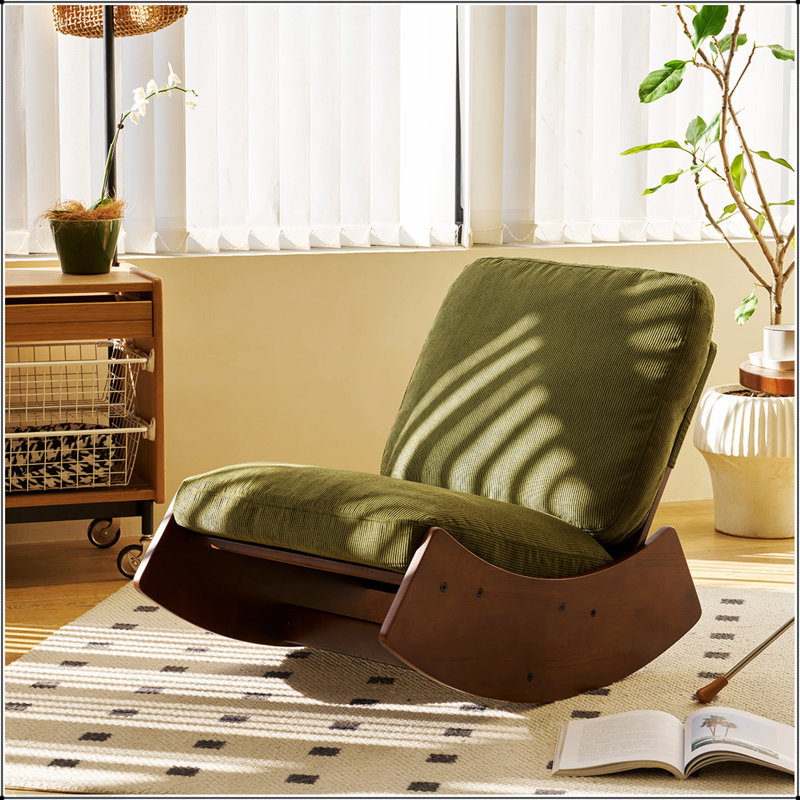 Chaise berçante confortable avec revêtement de haute qualité et structure en bois massif, parfaite pour la détente et la durabilité