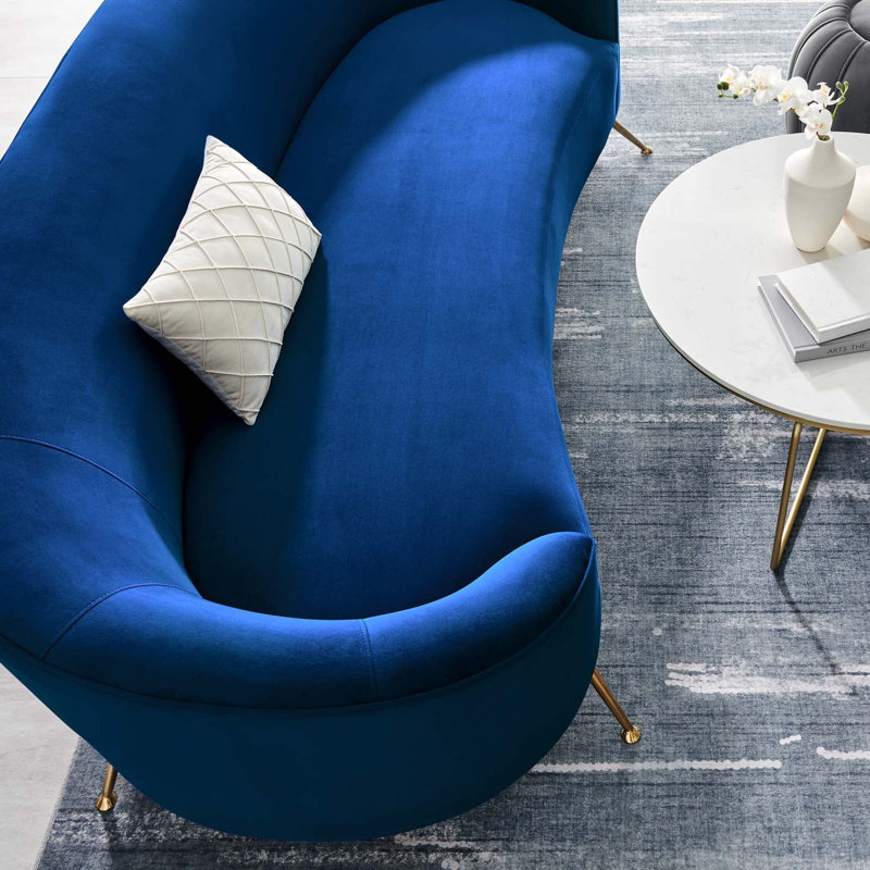 Navy Velvet Curved Sofa with Gold Legs and Sloped Arms