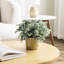 Faux eucalyptus artificiel en pot de ciment doré
