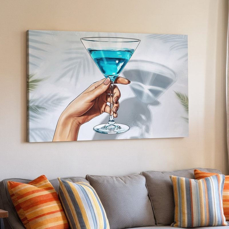 Toile, illustration en gros plan d'une main tenant élégamment un art mural Martini Glass mettant en vedette un cocktail bleu éclatant
