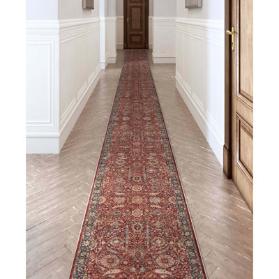 Tapis oriental rouge tissé à la machine
