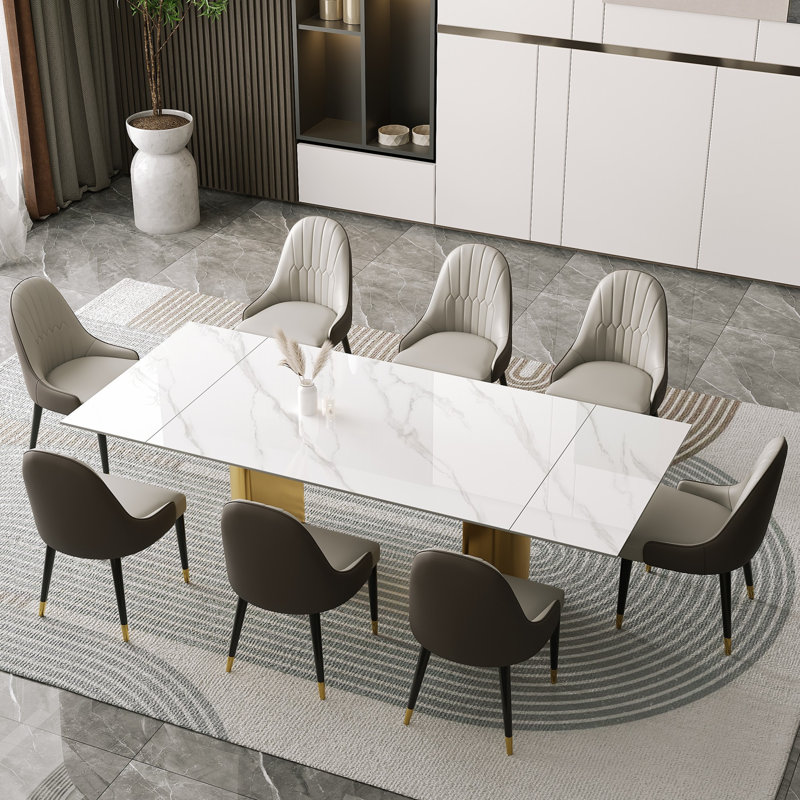 Sammie 9 - Piece 94.48'' Extendable Sintered Stone Dining Table with 8 Leather Chairs Dining Set, Gold, Snowy Mountain White
