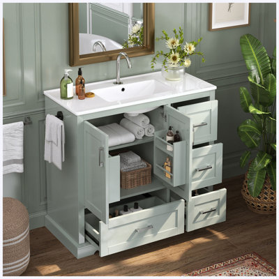 Meuble-lavabo sur pied de 107 cm (42 po) avec lavabo en céramique, 4 tiroirs (dont 2 supérieurs avec séparateurs), portes à fermeture amortie avec étagères intérieures, porte-serviettes réversible, vert menthe, MDF