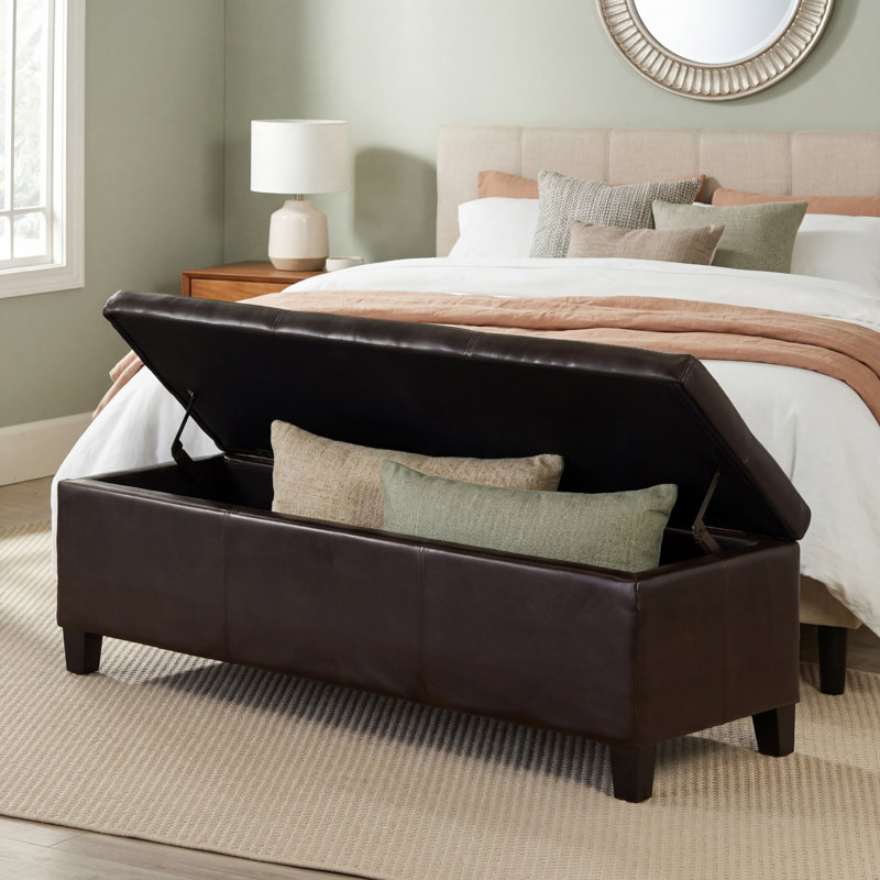 Repose-pieds brun en similicuir avec pieds en bois massif et rembourrage épais et doux Design moderne de surpiqûres; Rangement multifonctionnel à fermeture en douceur; Nécessite un assemblage simple.