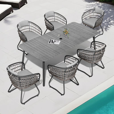 Ensemble repas pour 6 personnes avec coussins amovibles et trou pour parasol