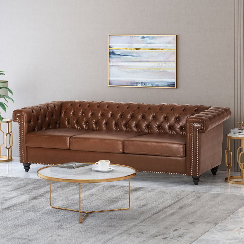 Canapé Chesterfield Sione, Similicuir cognac - assemblage incorrect