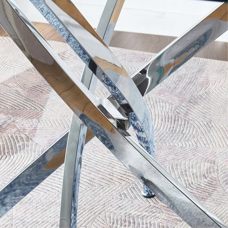 Table de salle à manger moderne en acier inoxydable et en verre avec un design élégant et une fabrication robuste.