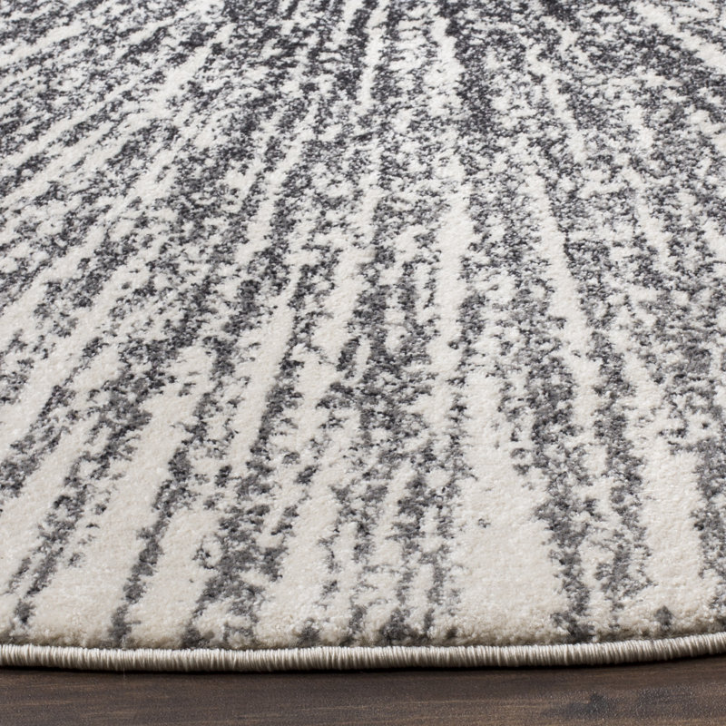 Tapis noir et ivoire à motif abstrait, Rond 6 pi 7 po