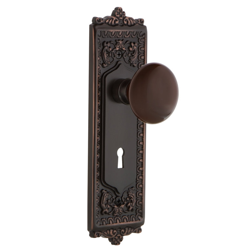 Egg & Dart Plate avec trou de serrure décoratif et bouton de porte en porcelaine brune, Bronze intemporel
