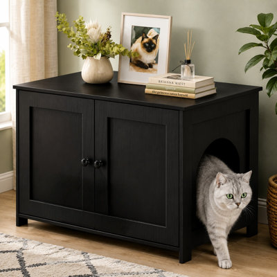 This Black farmhouse-style hidden kitty washroom pairs a low-entry, dog-proof wooden litter-box cabinet with home odor control, built-in storage, and decorative TV-stand functionality.