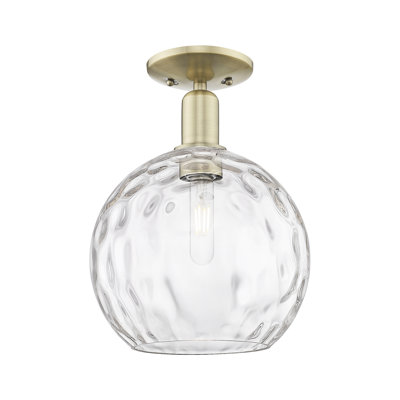 Arcadia - Champlon - 1 Light 10" Semi-Flush Mount - Antique Brass Finish - Clear Water Glass Shade