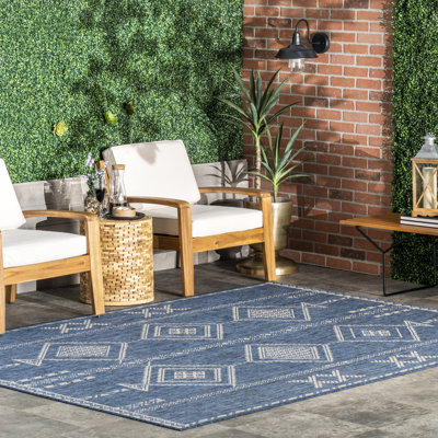 Tapis intérieur / extérieur bleu Achyut Southwestern
