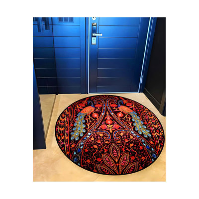 Tapis rond rond rouge à motif géométrique et deux paons