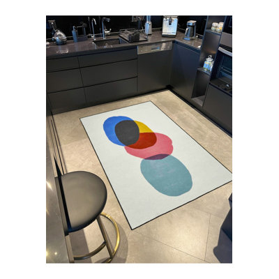 Tapis rond lavable à motif tissé coloré