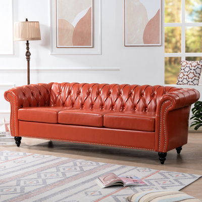 3 Seater With Rolled Arms, 85.87" Length, Pu Cover, Foam Cushioning, Solid Wood + Plywood Frame, Birch Legs, Max 660 Lbs Load Capacity Orange , Leather Covering, Staggered Buckles, Even , Sealed Legs