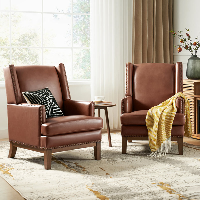 Fauteuil à oreilles Ariston en cuir véritable avec pieds en bois massif, Brun