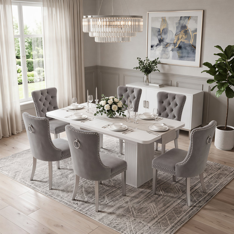 Ensemble de salle à manger extensible pour 4 à 8 personnes avec des chaises rembourrées en velours et une table centrale à double pied