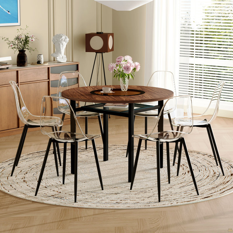 Ensemble table et chaises. Table de salle à manger ronde de 107 cm (42 pouces), style minimaliste moderne, fini bois brun. Comprend 6 chaises en plastique transparent avec pattes en métal noir. Pour un confort optimal à la maison.