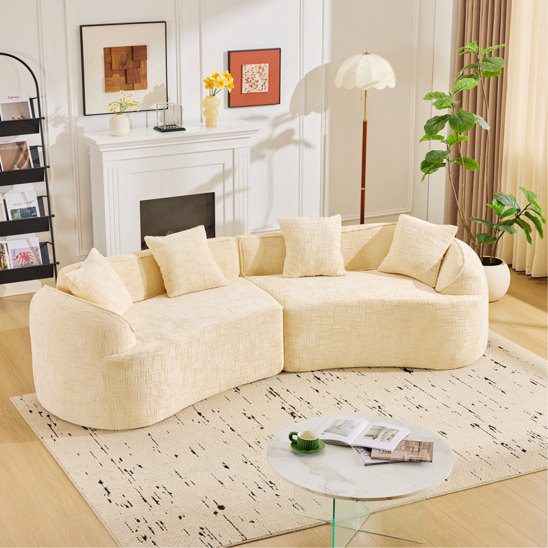 Canapé courbé avec quatre coussins, Beige