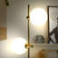Equinox 62" Modern Industrial Plug-In Wall Sconce with Gold Finish, Adjustable Heads, and Frosted Globe Shades, Integrated LED-69896183