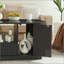 Table basse ovale avec tiroirs, portes et rangement ouvert