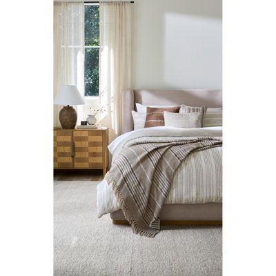 Davala Hand Knotted Wool Vintage Look Area Rug in Ivory