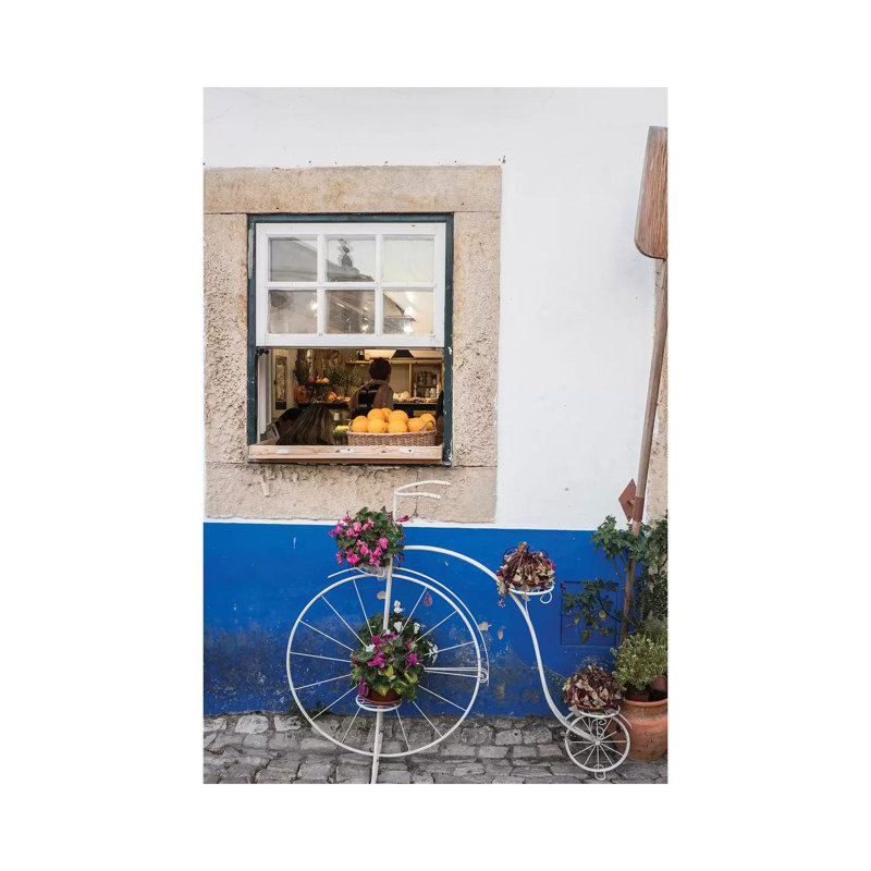 Cute Bicycle Planter In Front Of A Bakery In The Walled City, Obidos, Portugal by Julie Eggers - Wrapped Canvas Print