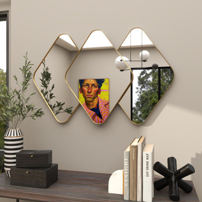 Miroir mural en métal doré
