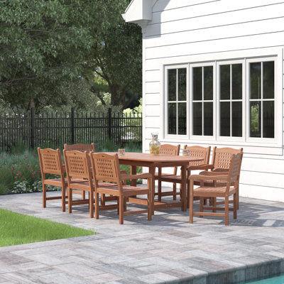 Anautica 8 - Person Wood Patio Dining Set with Oval Table