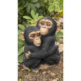 Chimpanzees Hugging Statue