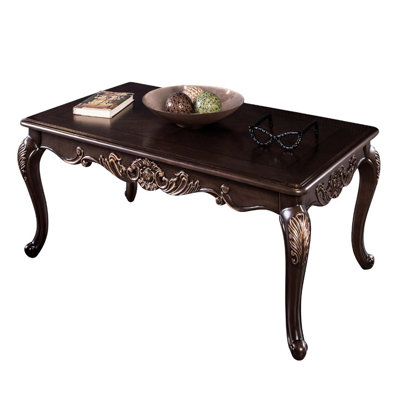Traditional Style Rectangle Coffee Table With Curved Legs, Solid Wood Structure, And Ornate Carved Design In Dark Cherry Finish