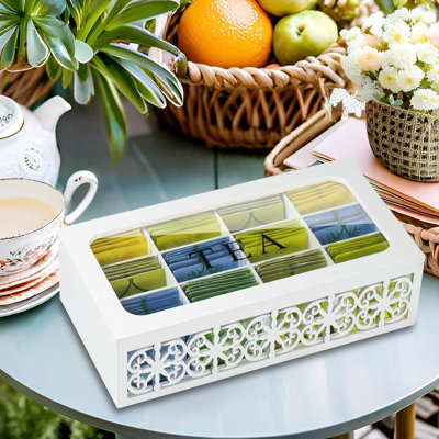 Boîte à thé décorative en bois avec couvercle transparent, 12 compartiments pour sachets de thé, motif floral ajouré, rangement polyvalent.