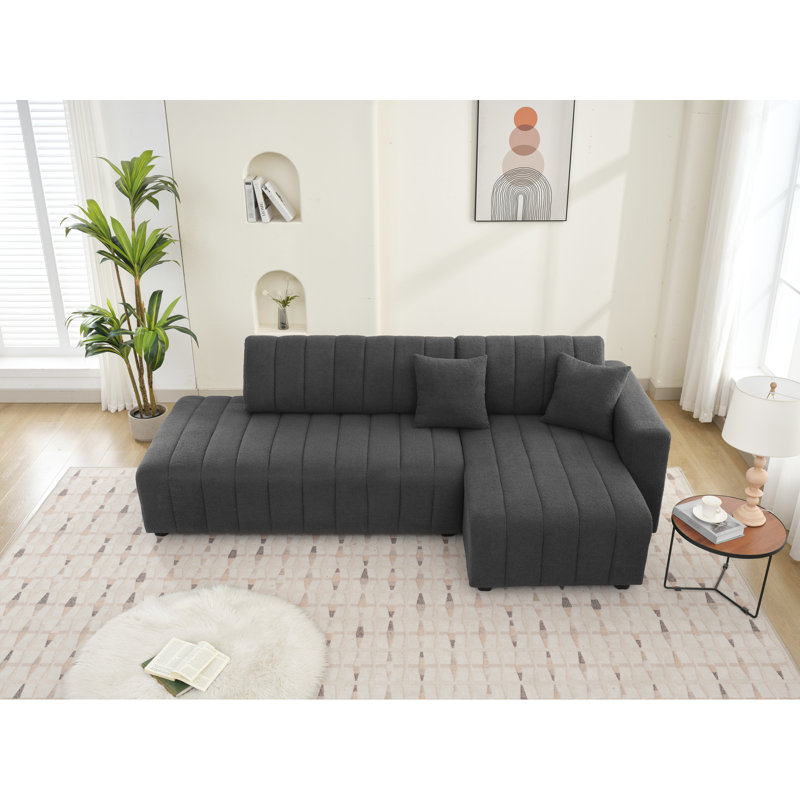 Coin en forme de L à 3 sièges avec esthétique scandinave, revêtement en laine gris foncé, rembourrage en mousse, modulaire et réversible, lignes épurées, palette neutre, style dossier, sièges, laine, rembourrage, couleurs,