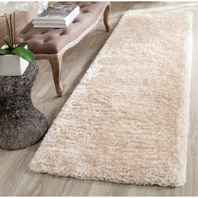 Delane Handmade Shag Champagne Area Rug