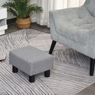 Petit repose-pieds élégant avec revêtement en tissu de lin et pieds en plastique durable pour une assise et un décor confortables