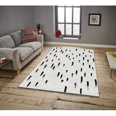 Tapis rectangulaire tissé à la machine Erkson en polyester ivoire / noir