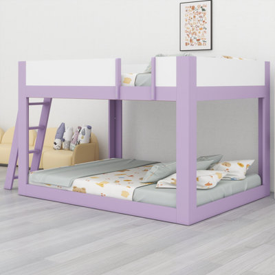 Bunk bed with reversible ladder and guardrails brings modern two-tone style to children's rooms and guest spaces